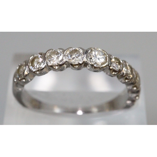 283 - Diamond half eternity ring of nine diamonds set in 18ct white gold.  Ring size Q.  Approx weight 3.9... 