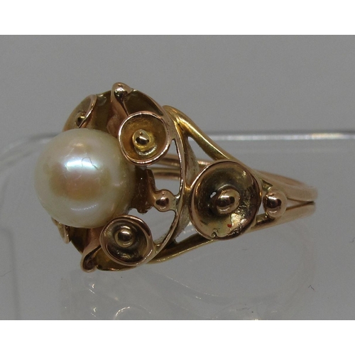 288 - Cultured pearl ring in decorative yellow metal setting.  Ring size L.  Approx weight 6.3 grams.  (B.... 