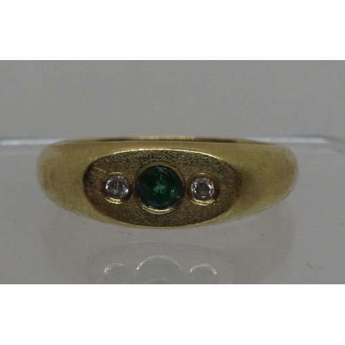 291 - Diamond and green stone ring set in 18ct gold. Ring size R.  Approx weight 5.9 grams.
(B.P. 21% + VA... 