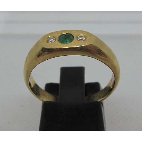 291 - Diamond and green stone ring set in 18ct gold. Ring size R.  Approx weight 5.9 grams.
(B.P. 21% + VA... 