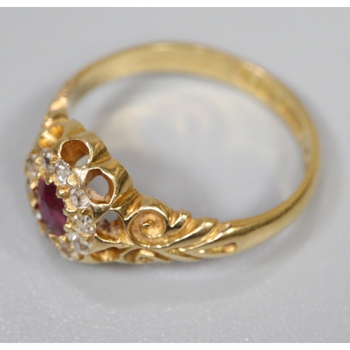 292 - Ruby and diamond cluster ring set in 18ct gold.  Ring size N&1/2.  Approx weight 3.6 grams.
(B.P. 21... 