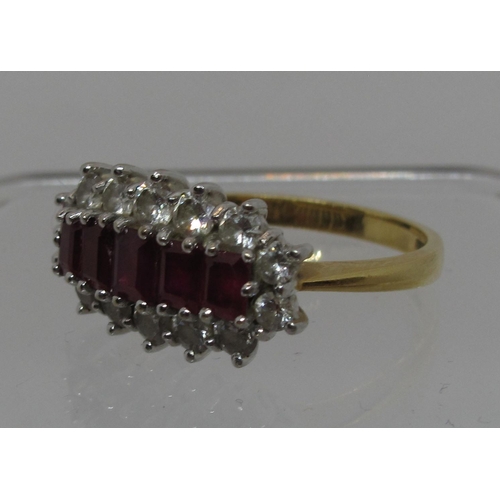 295 - Ruby and diamond boat shaped cluster ring set in 18ct gold.  The five graduated step cut rubies surr... 