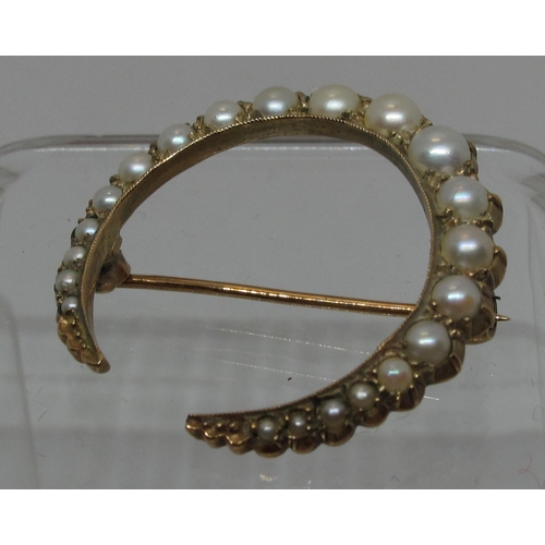 302 - Pearl set crescent brooch of twenty one graduated pearls set in 9ct gold.  Diameter approx 30mm. App... 