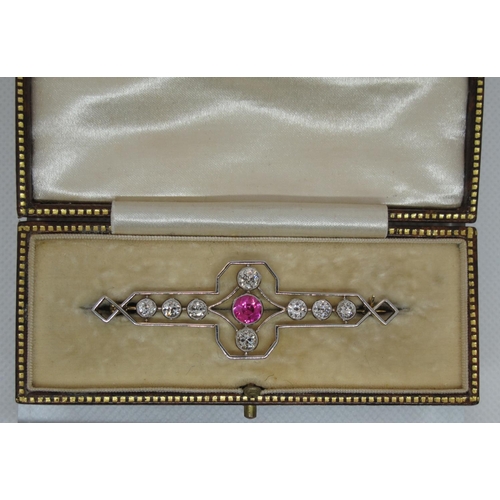 304 - Art Deco Pink corundum and diamond brooch.  The central pink stone set with an old cut diamond above... 