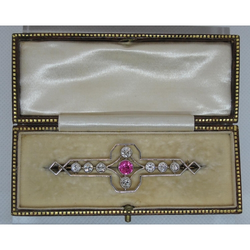 304 - Art Deco Pink corundum and diamond brooch.  The central pink stone set with an old cut diamond above... 