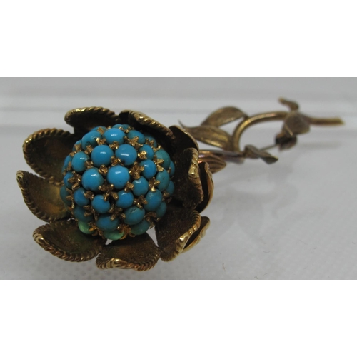 305 - Sunflower brooch delicately modelled as a flower in 18ct gold and set with turquoise stones.  In Har... 