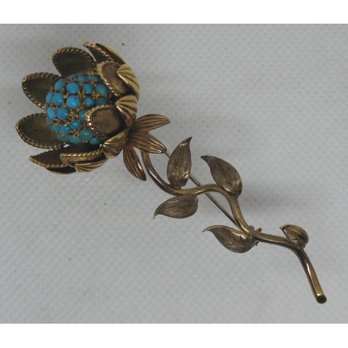 305 - Sunflower brooch delicately modelled as a flower in 18ct gold and set with turquoise stones.  In Har... 