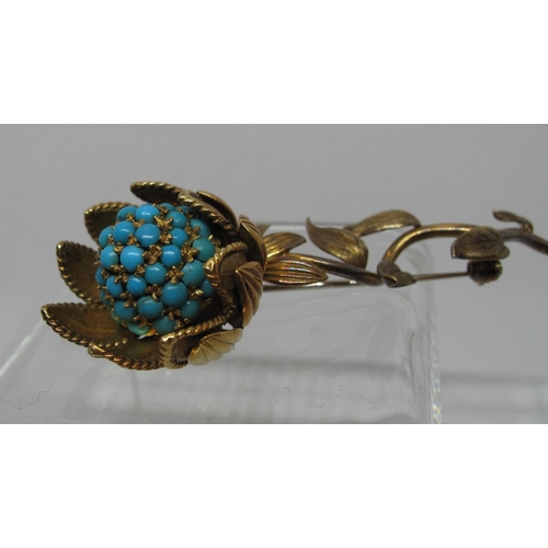 305 - Sunflower brooch delicately modelled as a flower in 18ct gold and set with turquoise stones.  In Har... 