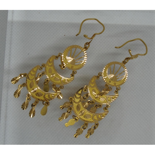 307 - A pair of Indian pendant earrings.  Yellow metal tests as 18ct gold.  Approx weight 13.4 grams.
(B.P... 