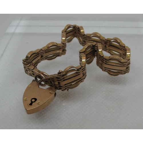 309 - 9ct gold fancy gate bracelet with heart shaped clasp.  Approx weight 18.9 grams.
(B.P. 21% + VAT)