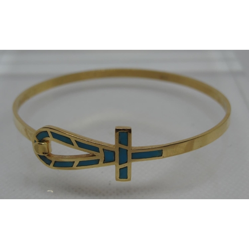 318 - Gold Ank bangle inset with turquoise stones with hook fastening.  Indistinct marks, tests as 18ct go... 