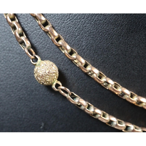 329 - A long Victorian chain with engraved gold beads.  Length 33 inches (34cm).  Approx weight 14.7 grams... 