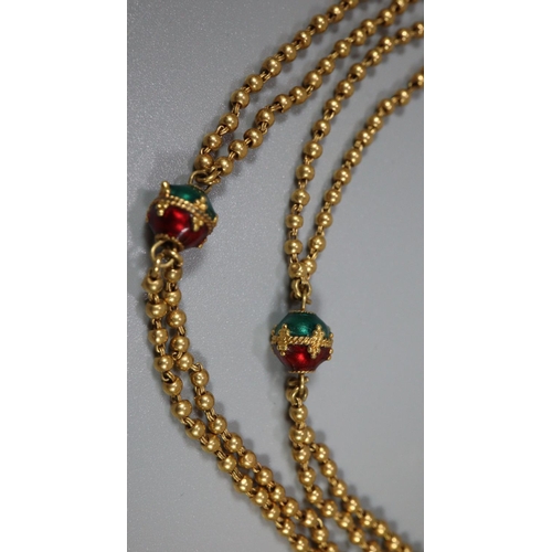 333 - Indian gold necklace decorated with red and green enamel gold beads.  Length 31 inches (79cm). Appro... 