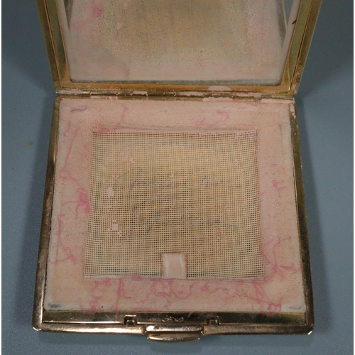 335 - An 18ct gold powder compact with woven detail.  Stamped 750 and engraved with an inscription to the ... 