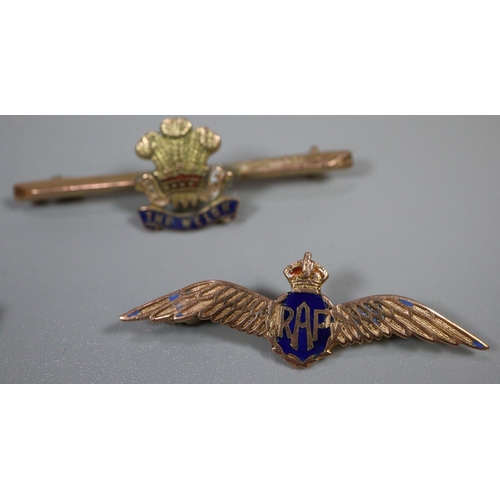 337 - Three 9ct gold sweetheart brooches.  RAF, RNAS and the Welsh regiment. Together with a 9ct gold engi... 