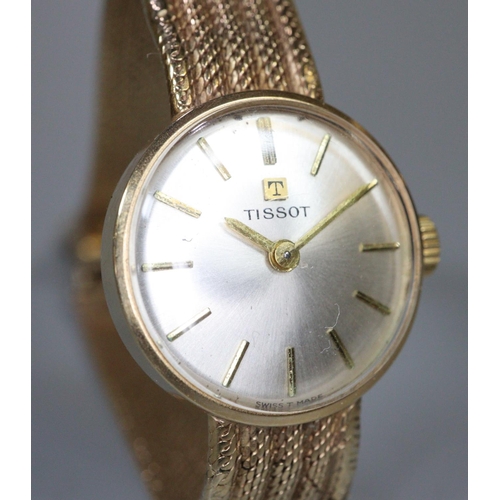 338 - Tissot 9ct gold ladies bracelet dress watch with satin face having baton numerals and gold mesh brac... 