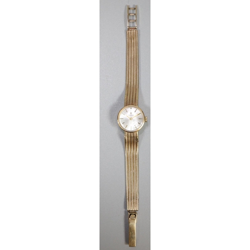 338 - Tissot 9ct gold ladies bracelet dress watch with satin face having baton numerals and gold mesh brac... 