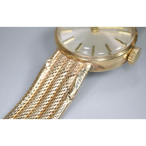 338 - Tissot 9ct gold ladies bracelet dress watch with satin face having baton numerals and gold mesh brac... 