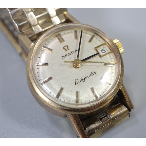 342 - Omega 9ct gold ladies bracelet dress watch, having circular gold face with baton numerals and bark f... 