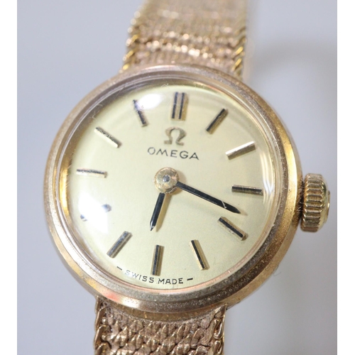 342 - Omega 9ct gold ladies bracelet dress watch, having circular gold face with baton numerals and bark f... 