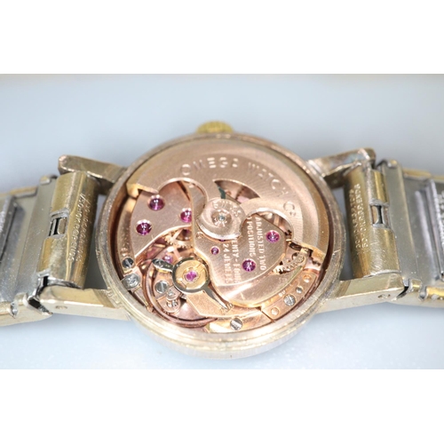 342 - Omega 9ct gold ladies bracelet dress watch, having circular gold face with baton numerals and bark f... 