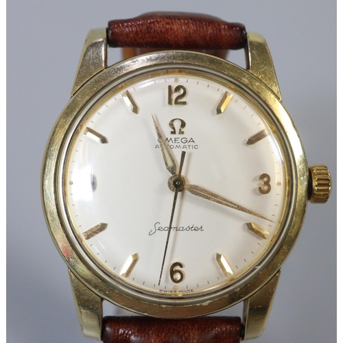 345 - Omega Seamaster Automatic gold plated gents wristwatch with satin face and baton numerals.  Associat... 