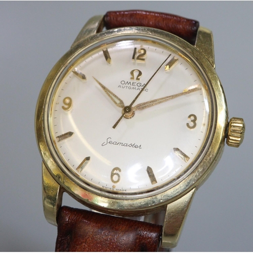 345 - Omega Seamaster Automatic gold plated gents wristwatch with satin face and baton numerals.  Associat... 