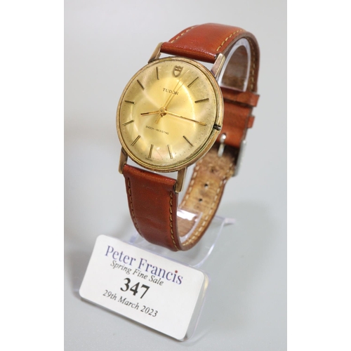 347 - A Tudor 9ct gold slim gentleman's dress watch, having gilt face with baton numerals on associated le... 