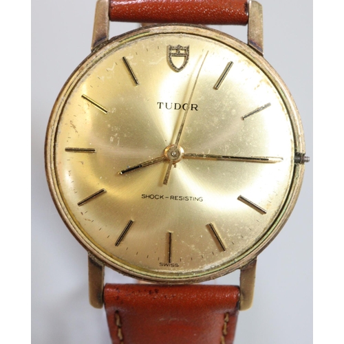 347 - A Tudor 9ct gold slim gentleman's dress watch, having gilt face with baton numerals on associated le... 