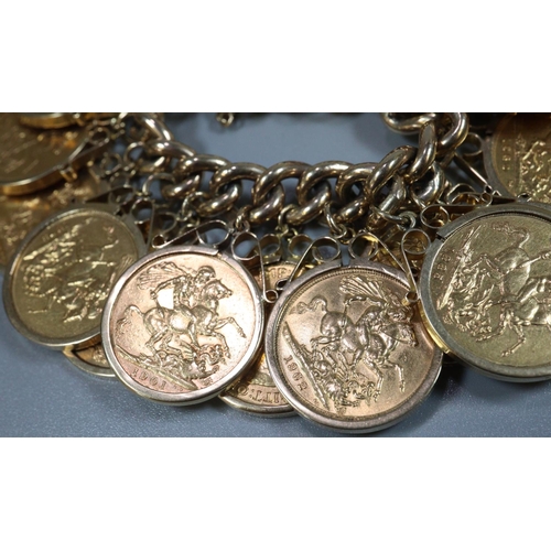 395 - 9ct gold curb link bracelet with heart padlock, set with 20 gold full sovereigns ,in pendant mounts ... 