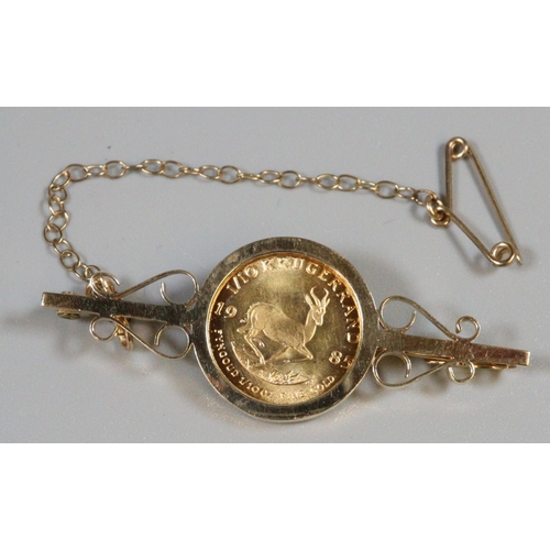 408 - 1/10th gold Krugerrand coin dated 1985 in 9ct gold brooch mount. Total weight 6.4g approx.
(B.P. 21%... 