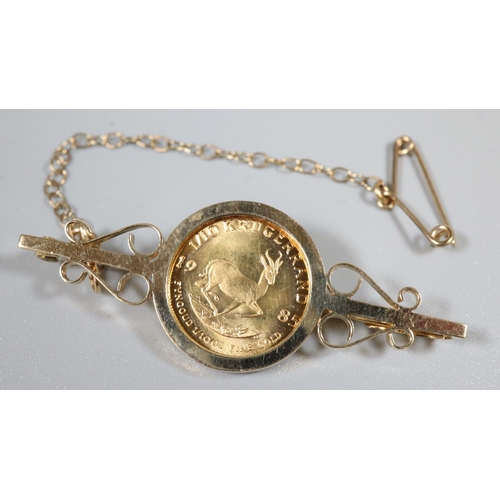 408 - 1/10th gold Krugerrand coin dated 1985 in 9ct gold brooch mount. Total weight 6.4g approx.
(B.P. 21%... 