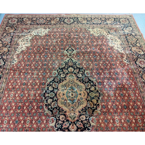 431 - Terracotta ground full wool pile Persian carpet with central medallion floral and foliate designs.  ... 