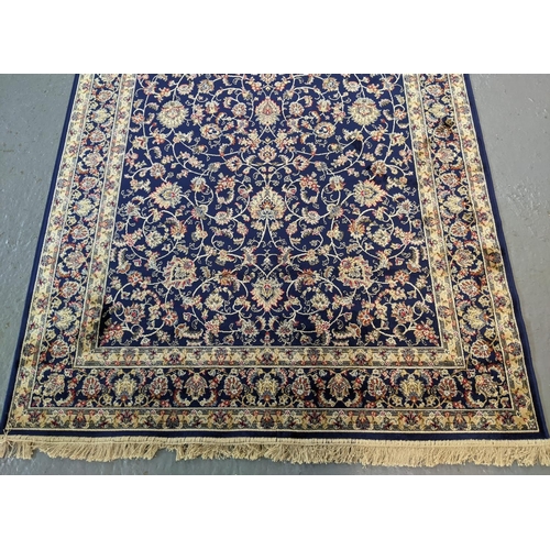 434 - Rich blue ground full pile Kashmir rug of floral and foliate design.  240x160cm approx.   (B.P. 21% ... 