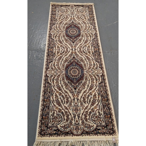 438 - Ivory ground fine woven Iranian runner with bespoke floral design.  310x100cm approx.   (B.P. 21% + ... 