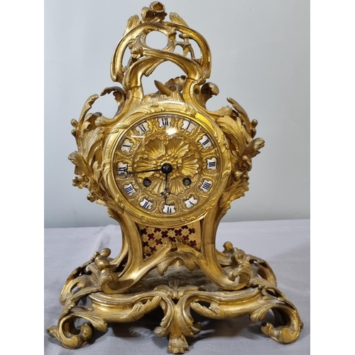 70 - Late 19th century French ormolu rococo style balloon shaped mantle clock, overall decorated with scr... 