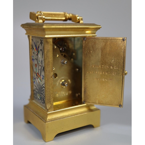 73 - Miniature gilt brass carriage clock with silvered and enamelled face and side panels decorated with ... 