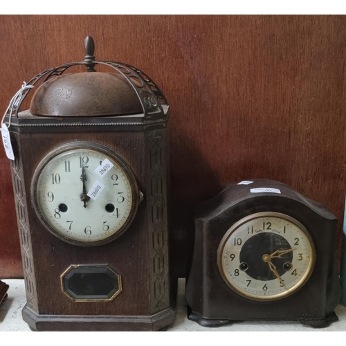 102 - Oxidised metal two train lantern design mantle clock with Arabic face, together with a Bakelite two ... 