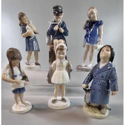 23 - Six Royal Copenhagen porcelain figurines of young children, one with kittens. Varying shape numbers.... 