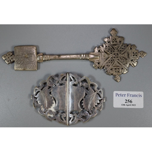 256 - White metal belt buckle decorated with foliage together with a white metal cross Touareg.  (B.P. 21%... 