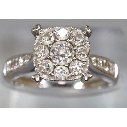 273 - Diamond cluster ring set in unmarked white metal.  Ring size K&1/2.  Approx weight 4 grams.
(B.P. 21... 