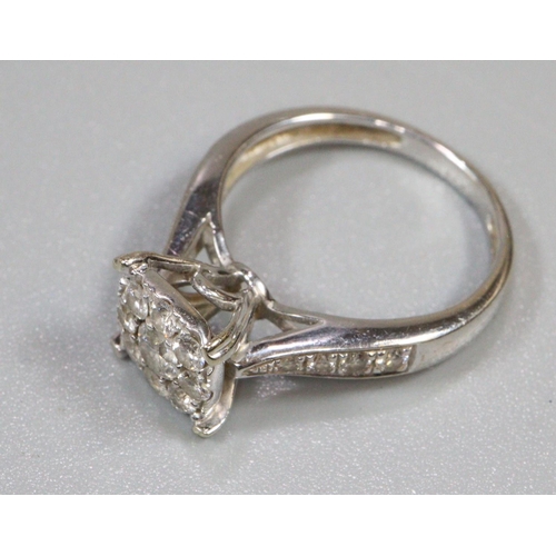 273 - Diamond cluster ring set in unmarked white metal.  Ring size K&1/2.  Approx weight 4 grams.
(B.P. 21... 