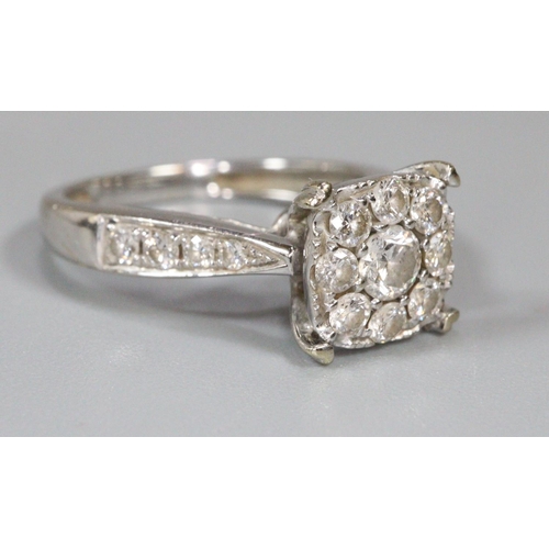 273 - Diamond cluster ring set in unmarked white metal.  Ring size K&1/2.  Approx weight 4 grams.
(B.P. 21... 