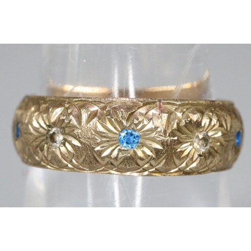 282 - 9ct gold ring engraved and set with blue and white stones.  Ring size O.  Approx weight 4 grams.
(B.... 