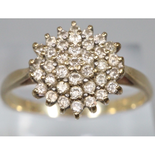 283 - Diamond cluster ring set in unmarked yellow metal.  Ring size U.  Approx weight 3.1 grams.
(B.P. 21%... 