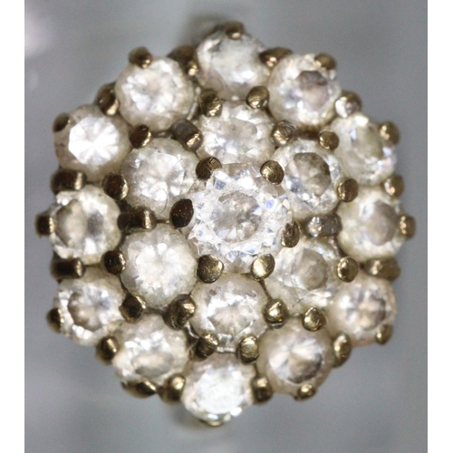 286 - 9ct gold cluster ring of white stones.  Ring size N.  Approx weight 4.6 grams.
(B.P. 21% + VAT)