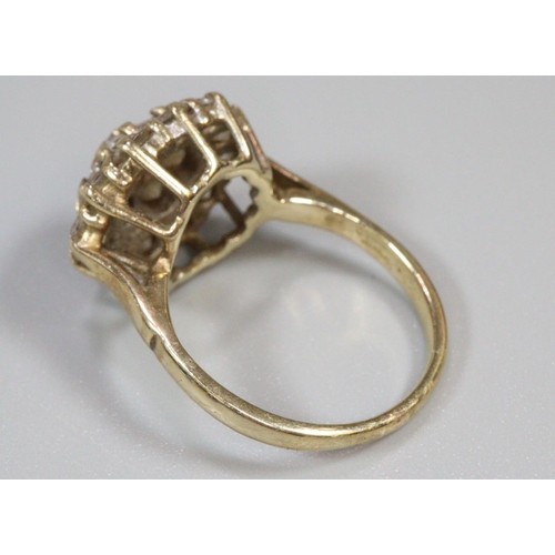 286 - 9ct gold cluster ring of white stones.  Ring size N.  Approx weight 4.6 grams.
(B.P. 21% + VAT)