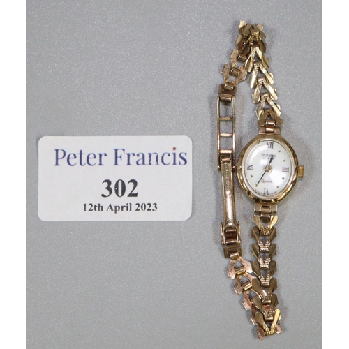 302 - Lady's Bernex wristwatch with 9ct gold strap.  Approx weight 10.4 grams.
(B.P. 21% + VAT)