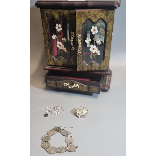 328 - A collection of silver and costume jewellery in a jewellery cabinet.
(B.P. 21% + VAT)