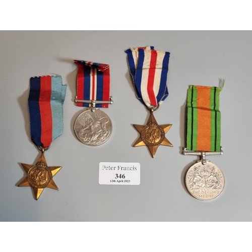 346 - Four WWII medals, to include: 1939-45 War Medal, 1939-45 Star, France and Germany Star, and Defense ... 